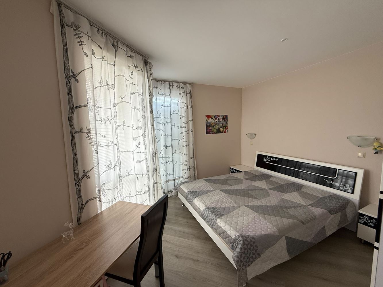One-bedroom apartment surrounded by greenery in a complex with a swimming pool and children's playground