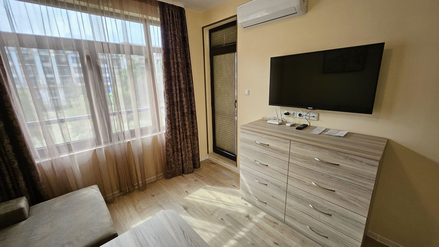 Cozy One-Bedroom Apartment in Pomorie with Low Maintenance Fee and View of a Landscaped Garden