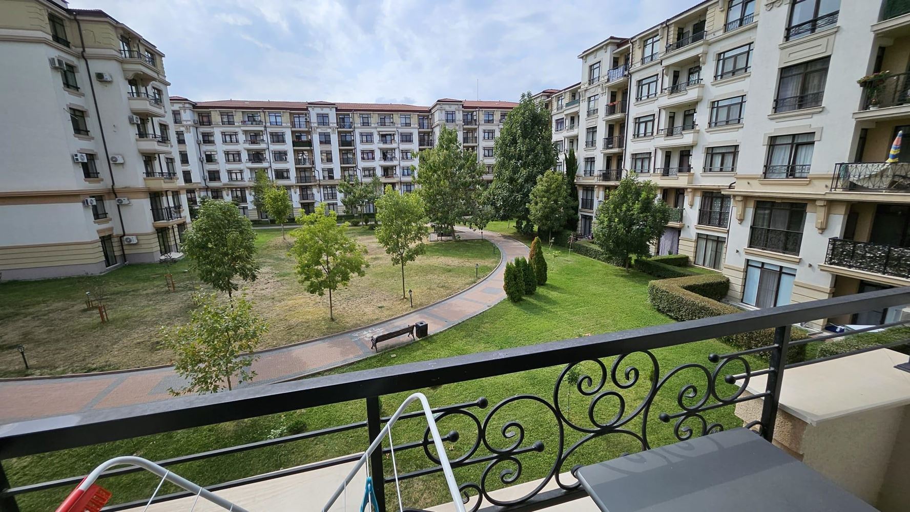 Cozy One-Bedroom Apartment in Pomorie with Low Maintenance Fee and View of a Landscaped Garden