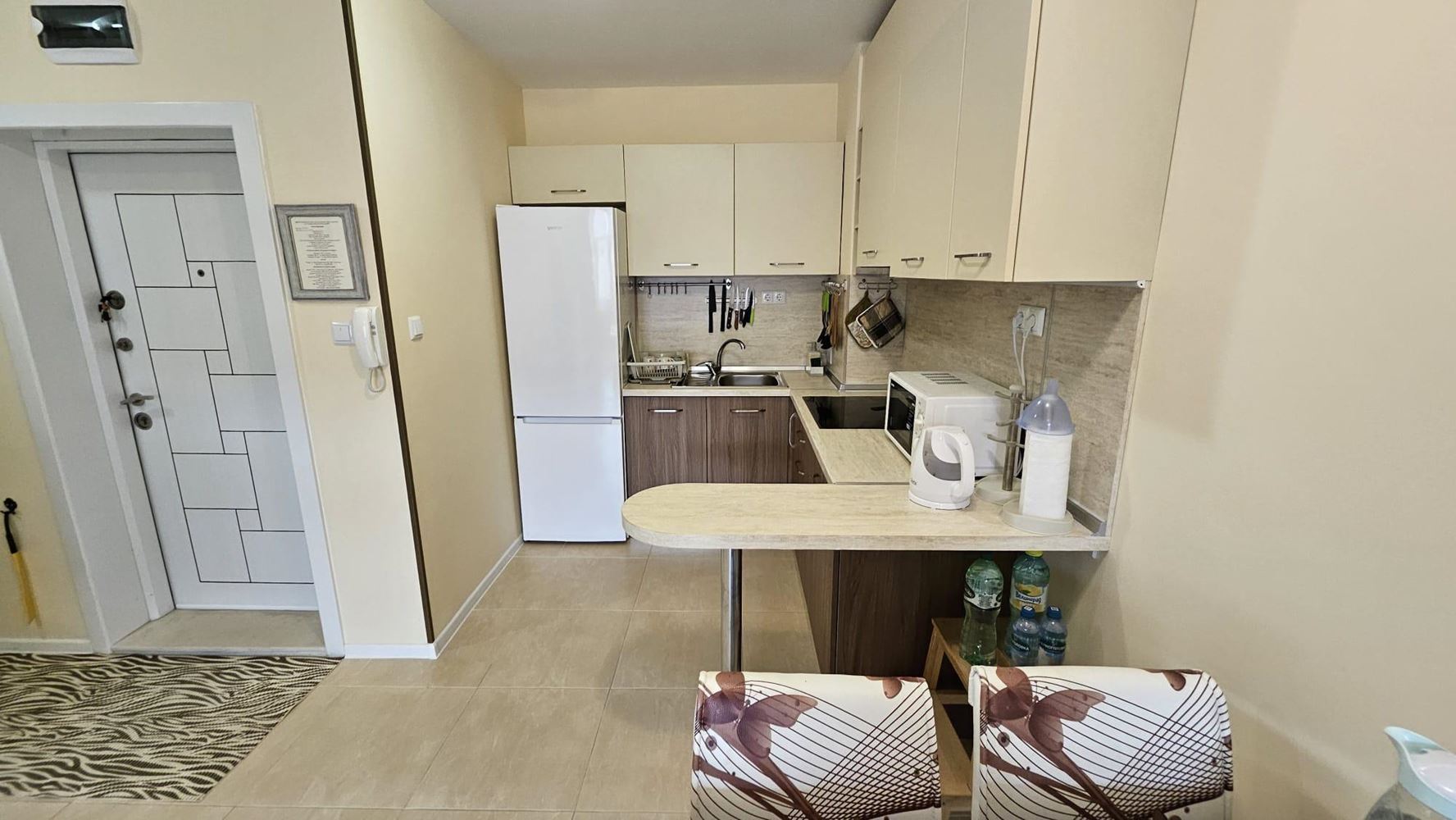 Cozy One-Bedroom Apartment in Pomorie with Low Maintenance Fee and View of a Landscaped Garden