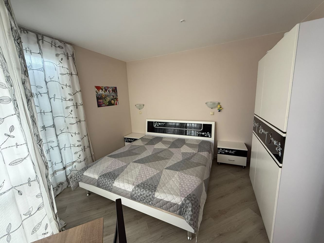 One-bedroom apartment surrounded by greenery in a complex with a swimming pool and children's playground