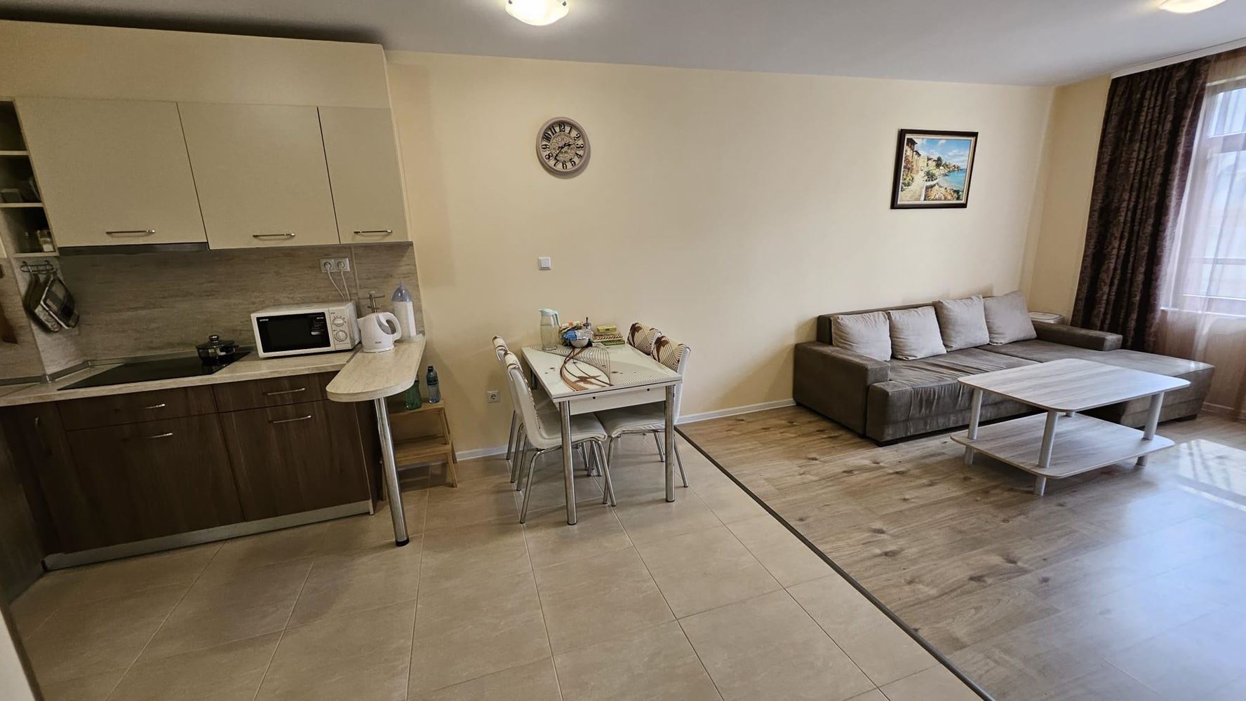 Cozy One-Bedroom Apartment in Pomorie with Low Maintenance Fee and View of a Landscaped Garden
