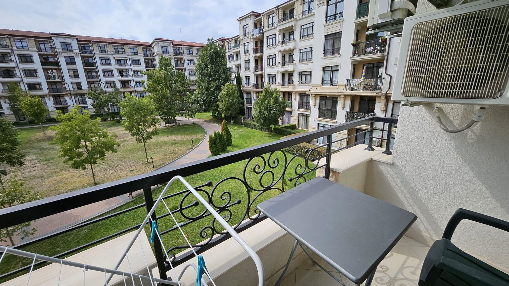 Cozy One-Bedroom Apartment in Pomorie with Low Maintenance Fee and View of a Landscaped Garden