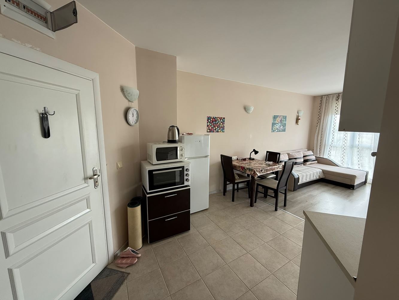 One-bedroom apartment surrounded by greenery in a complex with a swimming pool and children's playground
