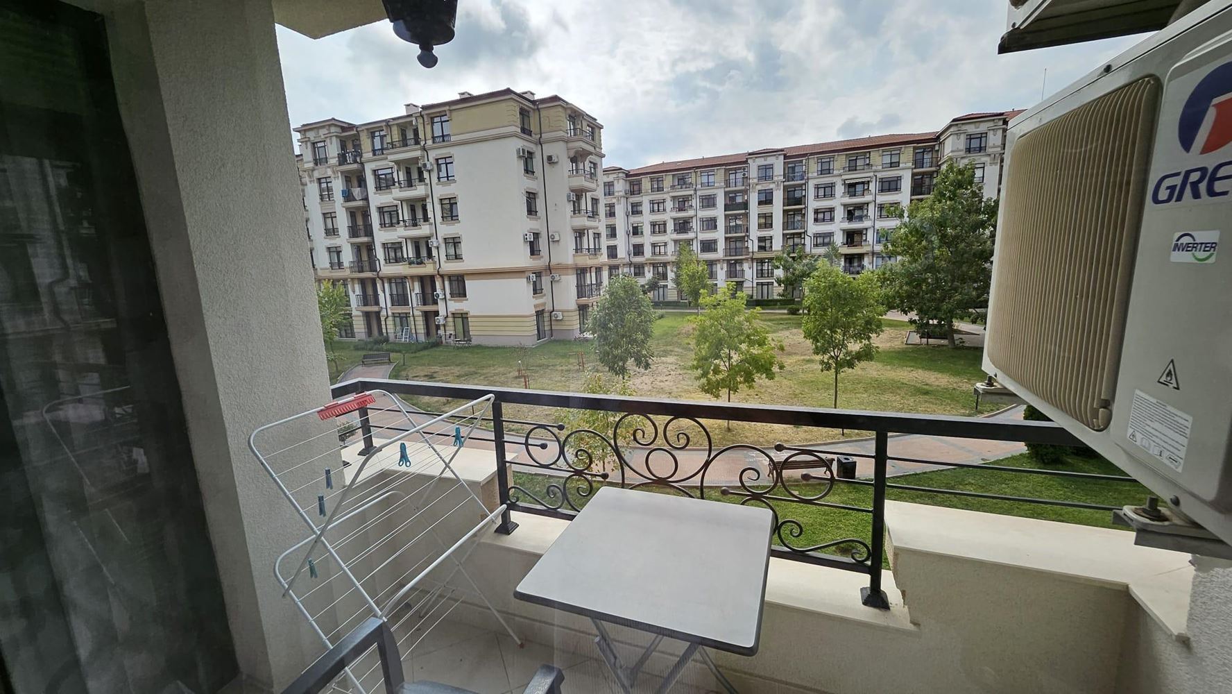 Cozy One-Bedroom Apartment in Pomorie with Low Maintenance Fee and View of a Landscaped Garden