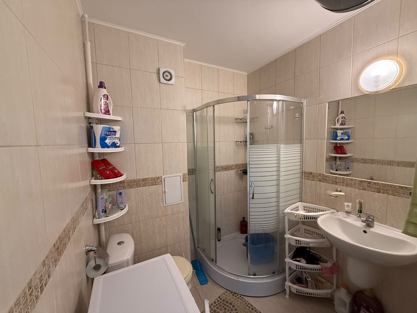 One-bedroom apartment surrounded by greenery in a complex with a swimming pool and children's playground