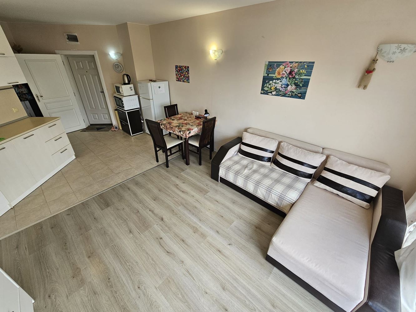 One-bedroom apartment surrounded by greenery in a complex with a swimming pool and children's playground